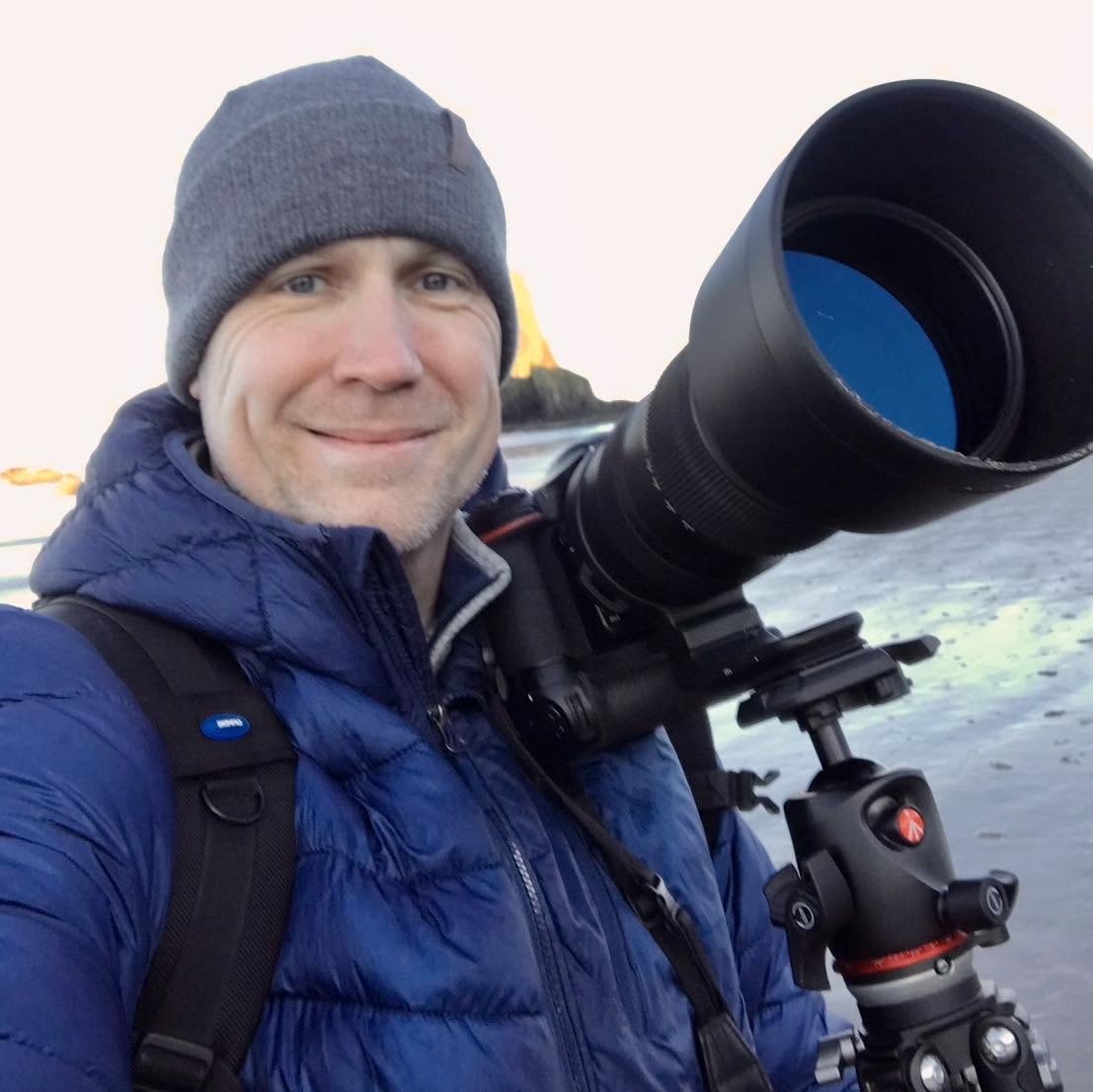 Danny Lund with a telephoto lens on a winter shore